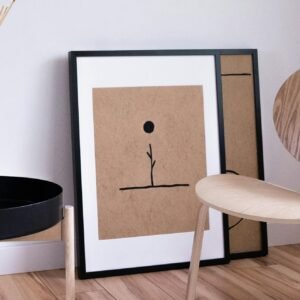 A serene Japandi style room with minimalist wooden furniture and abstract art on display.